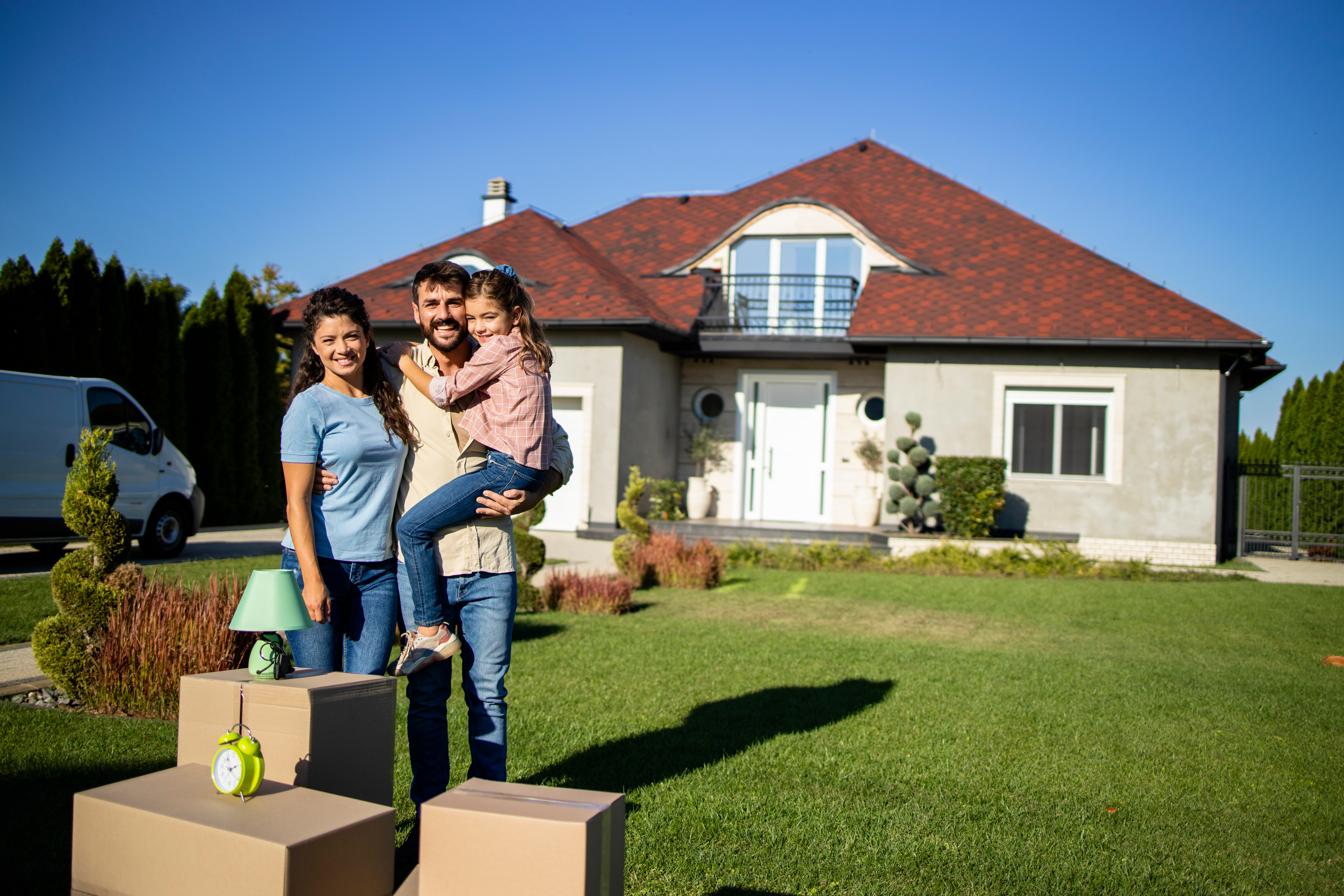 Happy family moving into their new home